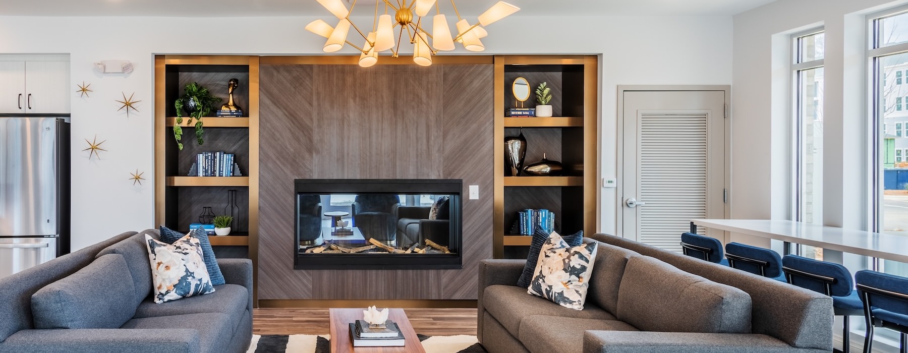 a clubroom with a tv and couches