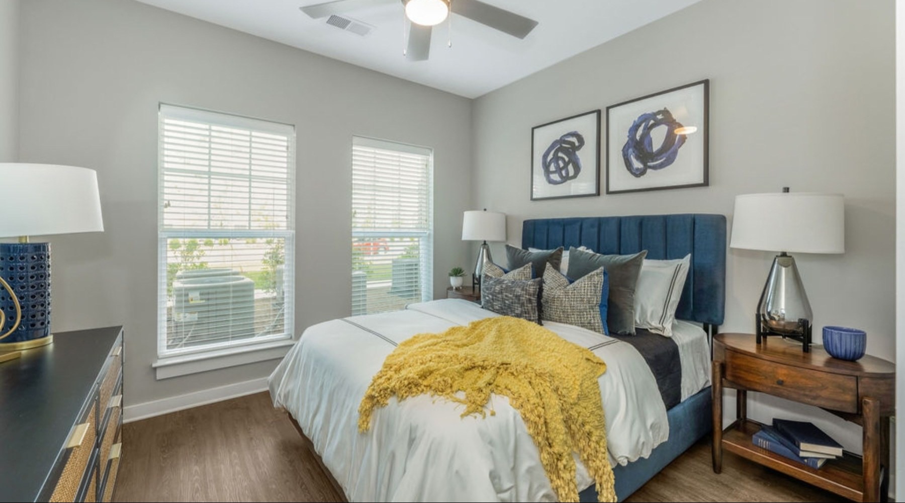 a bedroom with a bed and two nightstands