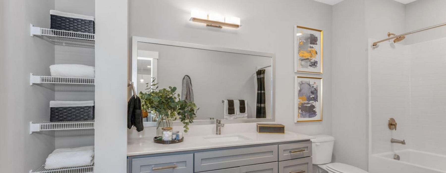 a bathroom with a tub, sink and toilet