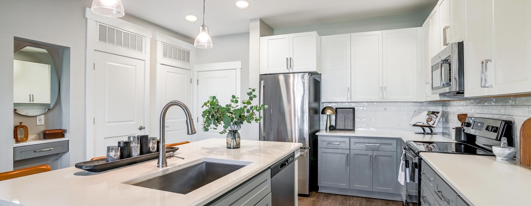 a kitchen with white cabinets