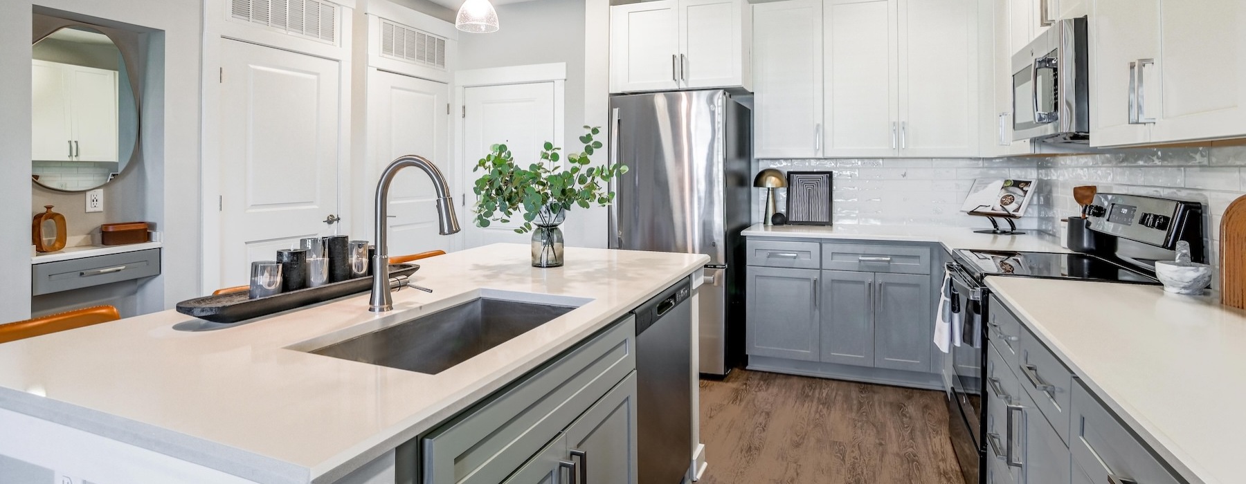 a kitchen with white cabinets
