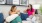 two women sitting on a couch