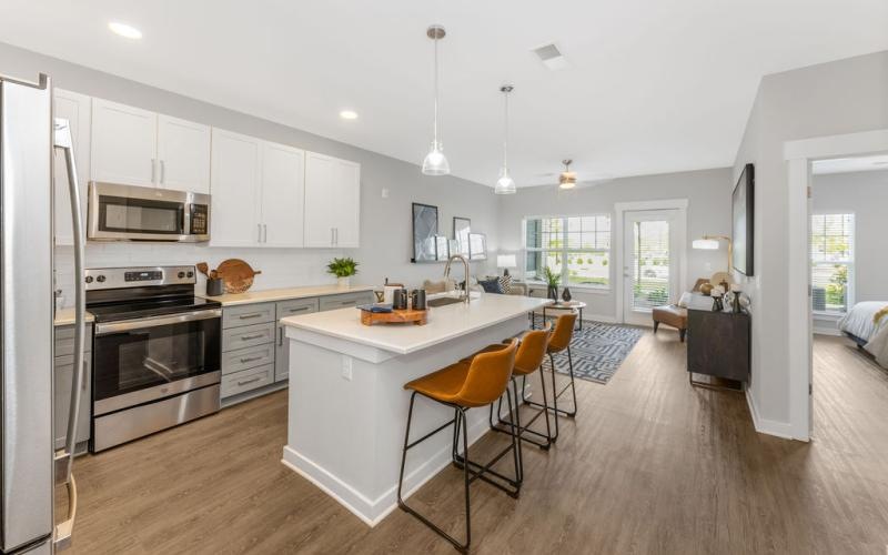 a kitchen with white cabinets